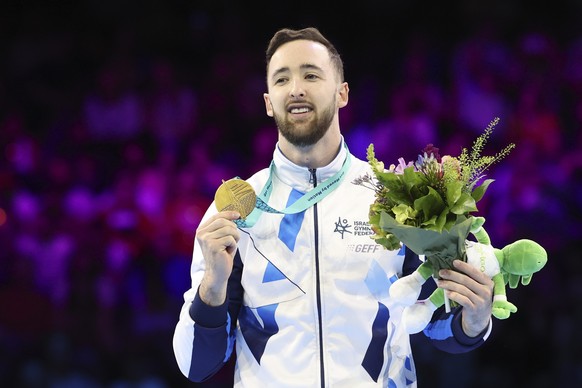 Israel&#039;s Artem Dolgopyat pose with the gold medal of the floor exercise during the apparatus finals at the Artistic Gymnastics World Championships in Antwerp, Belgium, Saturday, Oct. 7, 2023. (AP ...