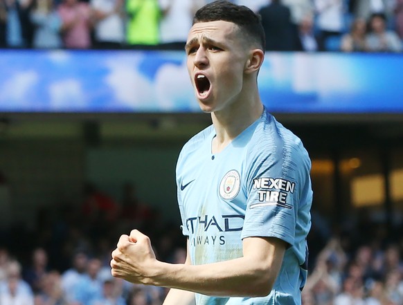 epa07517288 Manchester City's Phil Foden celebrates scoring a goal during the English Premier League soccer match between Manchester City and Tottenham Hotspur at the Etihad Stadium in Manchester ...