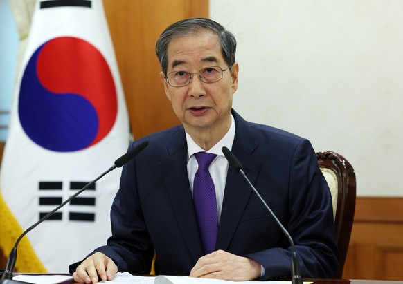 epa12066230 Acting President and Prime Minister Han Duck-soo speaks during a meeting of security-related ministers at the government complex in Seoul, South Korea, 01 May 2025. EPA/YONHAP / POOL SOUTH ...
