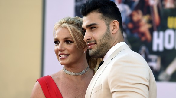 FILE - Britney Spears and Sam Asghari arrive at the Los Angeles premiere of &quot;Once Upon a Time in Hollywood,&quot; at the TCL Chinese Theatre, Monday, July 22, 2019. Spears, less than five months  ...