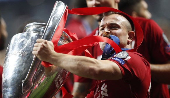 Liverpool&#039;s Xherdan Shaqiri celibrates with the trophy after Liverpool won the Champions League final soccer match between Tottenham Hotspur and Liverpool at the Wanda Metropolitano Stadium in Ma ...