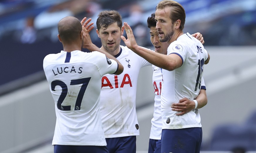 Tottenham&#039;s Harry Kane, right, celebrates after scoring his side&#039;s second goal during the English Premier League soccer match between Tottenham Hotspur and Leicester City, at the Tottenham H ...