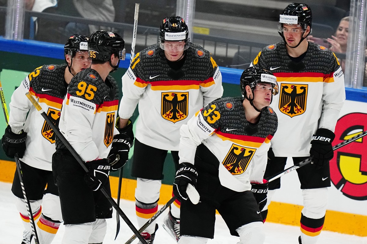 Germany's John Peterka, second from right, celebrates with teammates after scoring his side's fifth goal during the group A match between Germany and Hungary at the ice hockey world champion ...