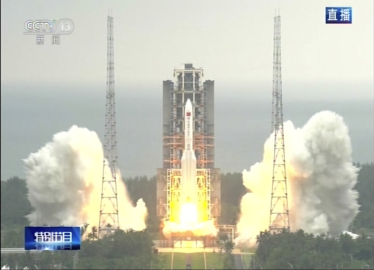 In this image taken from video footage run by China's CCTV via AP Video, a Long March 5B rocket carrying a module for a Chinese space station lifts off from the Wenchang Spacecraft Launch Site in ...