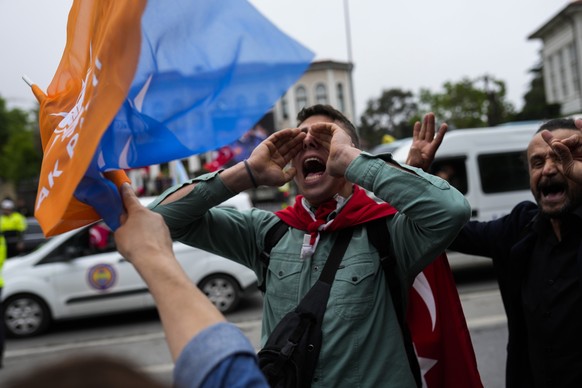 Supporters of the Turkish President Recep Tayyip Erdogan shout slogans outside his house in Istanbul, Turkey, Sunday, May 28, 2023. President Recep Tayyip Erdogan, who has been at Turkey's helm f ...