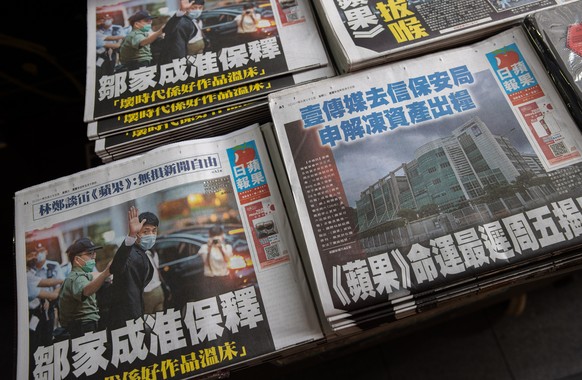 epa09294670 Copies of Apple Daily newspaper are for sale at a newsstand in Hong Kong, China, 23 June 2021. The owner of the newsstand decided not to return the copies from the previous days and to kee ...