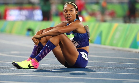 epa05488714 Allyson Felix of the USA reacts after winning the silver medal in the women's 400m final of the Rio 2016 Olympic Games Athletics, Track and Field events at the Olympic Stadium in Rio de Ja ...