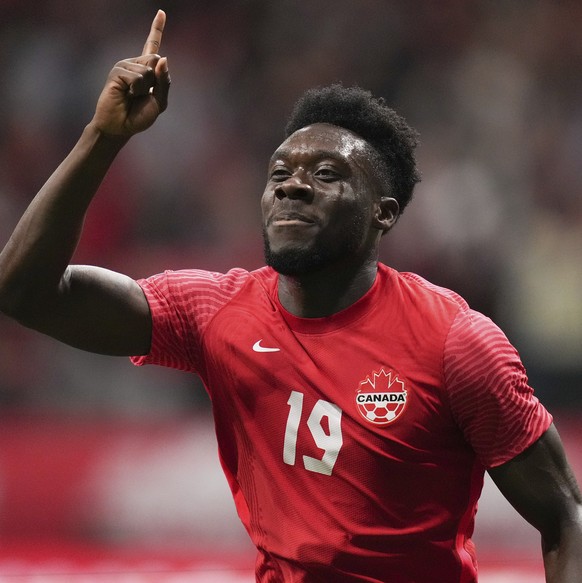 FILE - Canada&#039;s Alphonso Davies celebrates his penalty-kick goal against Curacao during the first half of a CONCACAF Nations League soccer match Thursday, June 9. 2022, in Vancouver, British Colu ...