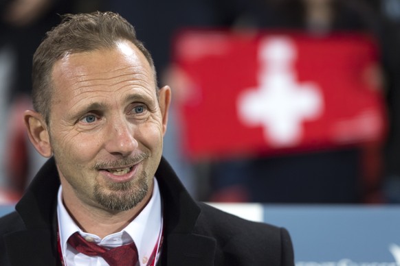 Switzerland&#039;s head coach Mauro Lustrinelli smiles before a qualification soccer match for the European Under 21 Championship between Switzerland and France at the Stadium Stade de la Maladiere, i ...