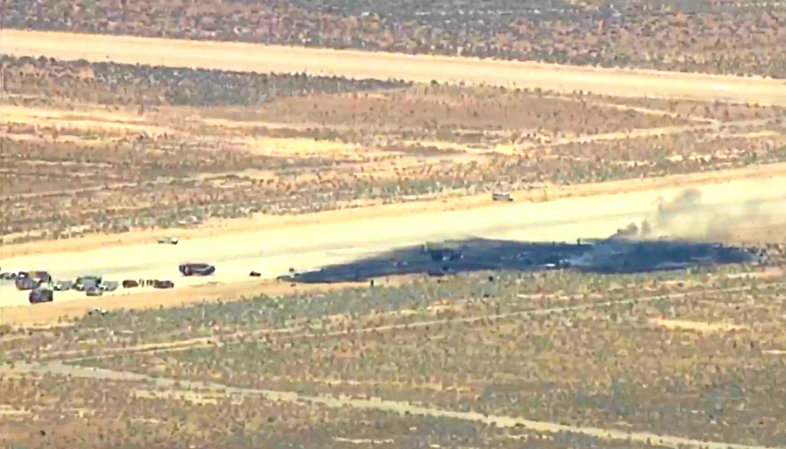 This image taken from video provided by KABC shows law enforcement responding to the scene of an aircraft crash, Monday, June 15, 2026, near Edwards Air Force Base, Calif. (KABC via AP)
Military Crash ...