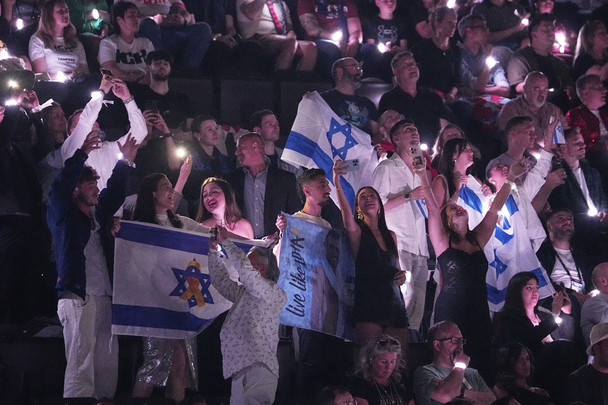 An Israeli fans cheer for Yuval Raphael from Israel as she perform the song "New Day Will Rise" during the second semi-final of the 69th Eurovision Song Contest, in Basel, Switzerland, Thurs ...