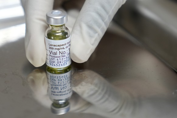 A pharmacist holds a vial of lenacapavir, the new HIV prevention injectable drug, at the Desmond Tutu Health Foundation&#039;s Masiphumelele Research Site, in Cape Town, South Africa, Tuesday, July 23 ...