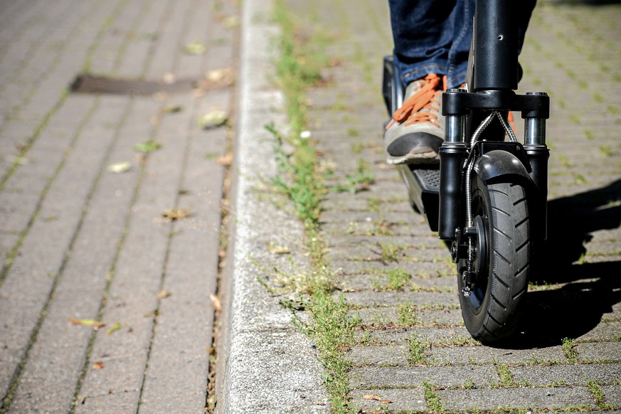 epa07627012 A man rides an CIRC e-scooter (former FLASH) in Herne, Germany, 05 June 2019. Even before electric pedal-scooters are allowed nationwide on 15 June, a first provider will start a rental se ...