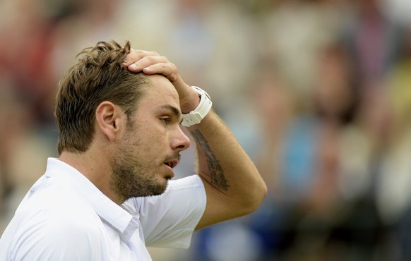 epa04837560 Stan Wawrinka of Switzerland in action against Richard Gasquet of France during their quarter final match for the Wimbledon Championships at the All England Lawn Tennis Club, in London, Br ...