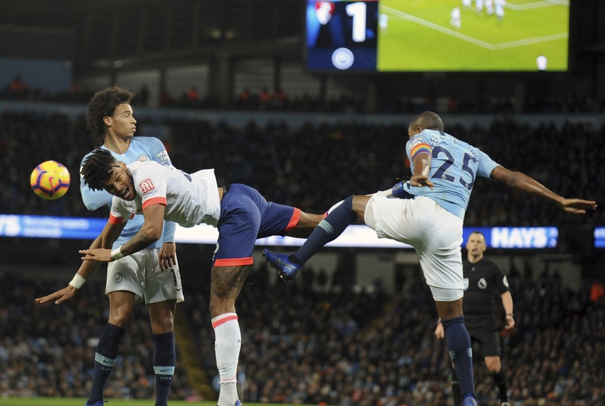 Manchester City&#039;s Fernandinho, right, duels for the ball with Bournemouth&#039;s Nathan Ake during the English Premier League soccer match between Manchester City and Bournemouth at Etihad stadiu ...