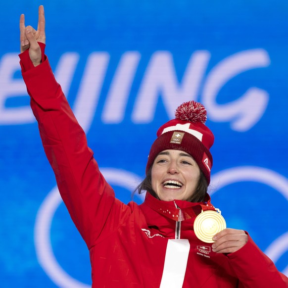 Mathilde Gremaud of Switzerland, gold medal winner in the women's Freestyle Skiing Slopestyle, poses with the medal during the medal ceremony at the 2022 Winter Olympics in Zhangjiakou, China, on ...