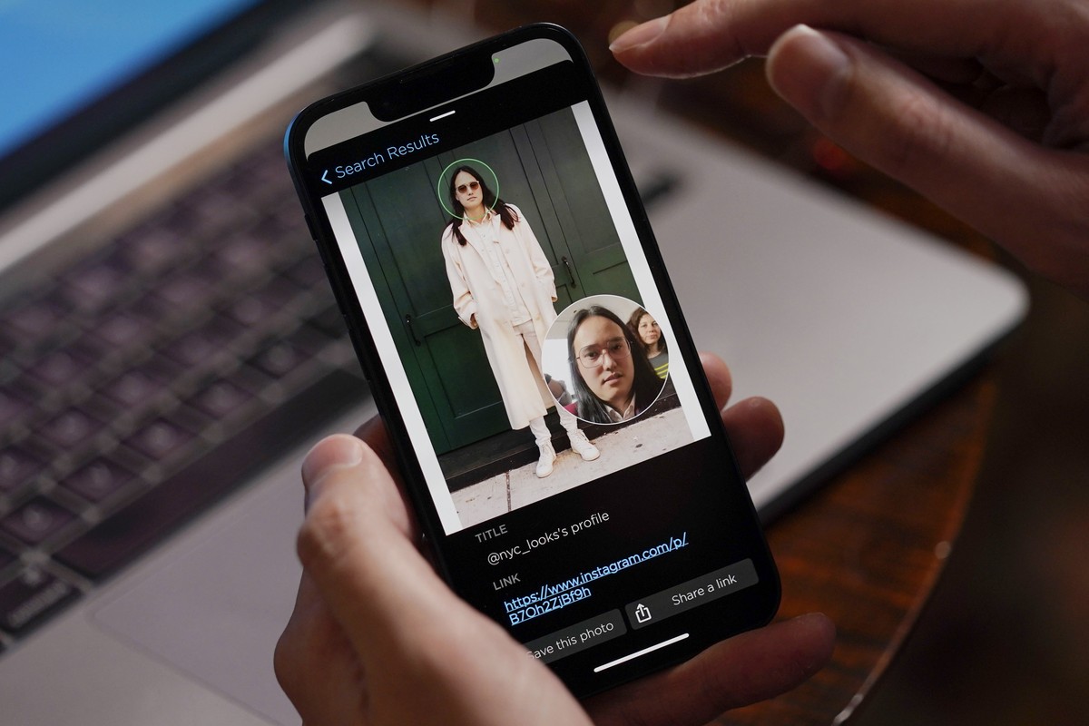 FILE - Hoan Ton-That, CEO of Clearview AI, demonstrates the company's facial recognition software using a photo of himself in New York on Tuesday, Feb. 22, 2022. In a Monday, May 9, 2022 legal fi ...