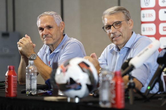 Switzerland's team director Pierluigi Tami, left, and Peter Knaebel, President Swiss Football Federation SFV, attend a press conference one day after beeing defeated in the World Cup quarter fina ...