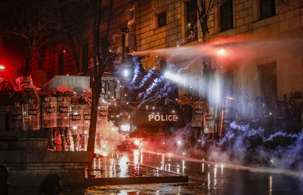 epaselect epa11753572 Police use water cannons to disperse Georgian opposition supporters protesting in front of the Parliament building in Tbilisi, Georgia, 02 December 2024. Thousands of pro-EU acti ...