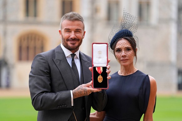 Sir David Beckham, with his wife Lady Victoria, after he was made a Knight Bachelor at an investiture ceremony at Windsor Castle, Berkshire, England, Tuesday, Nov. 4, 2025. (Andrew Matthews/Pool Photo ...