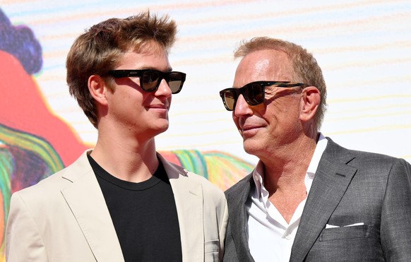 epa11591244 US director Kevin Costner (R) and his son Caydon Wyatt Costner arrive for the premiere of &#039;Horizon: An American Saga - Chapter Two&#039; during the 81st annual Venice International Fi ...