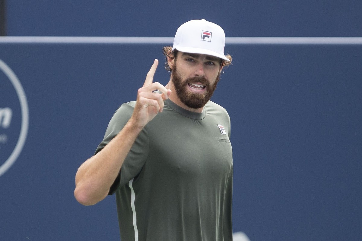 Reilly Opelka celebrates his 6-3, 7-6 win over Spain's Roberto Bautista Agut at the men's National Bank Open tennis tournament in Toronto, Friday, Aug. 13, 2021. (Chris Young/The Canadian Pr ...