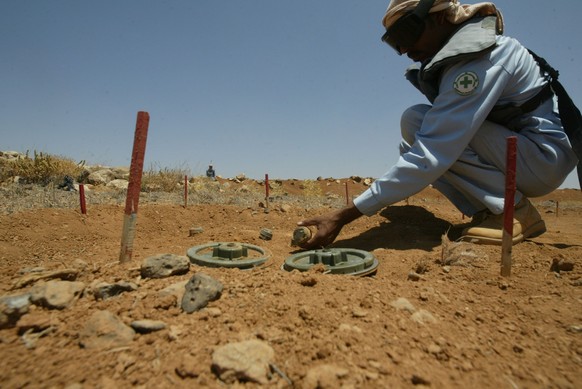 JABER, JORDAN- JULY 08: A deminer works in a field along the border between Jordan and Syria on July 08 and 2008 near Jaber, Jordan. The National Committee for De-mining and Rehabilitation (NCDR) last ...