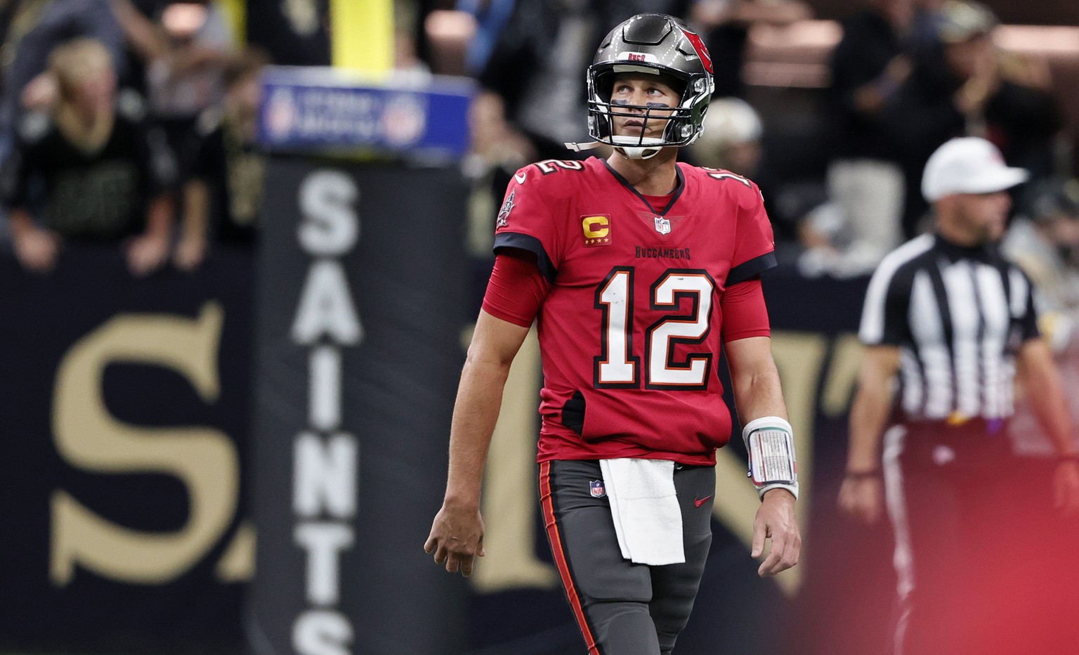 Tampa Bay Buccaneers quarterback Tom Brady (12) reacts after throwing an interception in the second half of an NFL football game against the New Orleans Saints in New Orleans, Sunday, Oct. 31, 2021. ( ...