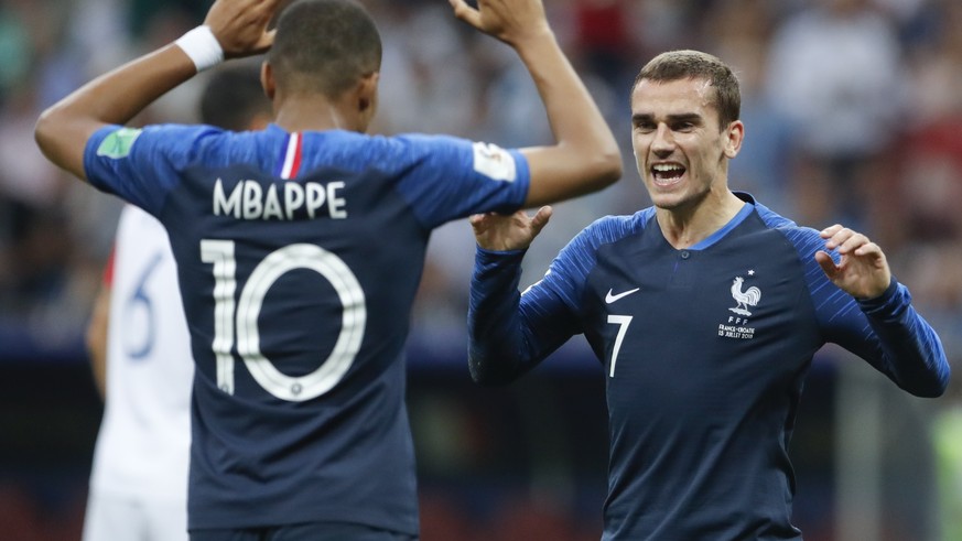 France&#039;s Antoine Griezmann celebrates with his teammate Kylian Mbappe, left, after Paul Pogba scored his side&#039;s 3rd goal, during the final match between France and Croatia at the 2018 soccer ...