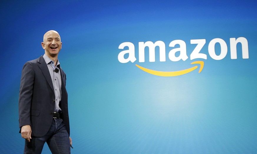 FILE - In this June 16, 2014, file photo, Amazon CEO Jeff Bezos walks onstage for the launch of the new Amazon Fire Phone, in Seattle. Bezos offered a glimpse of his vision for the future during an in ...