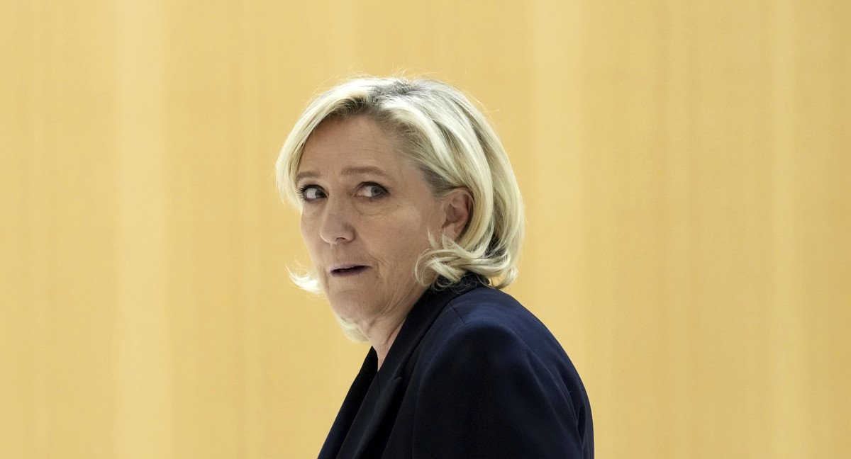 French far-right leader Marine Le Pen arrives at the courtroom for the trial over the suspected embezzlement of European Parliament funds, Wednesday, Nov. 6, 2024 in Paris. (AP Photo/Aurelien Morissar ...