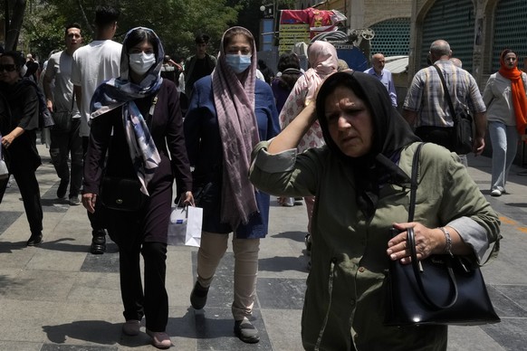 Women walk around the old main bazaar of Tehran, Iran, Thursday, June 13, 2024. (AP Photo/Vahid Salemi)