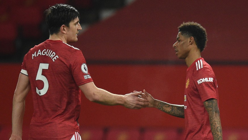 epa09028618 Manchester United&#039;s Marcus Rashford (R) celebrates with Harry Maguire (L) after scoring the 1-0 during the English Premier League soccer match between Manchester United and Newcastle  ...