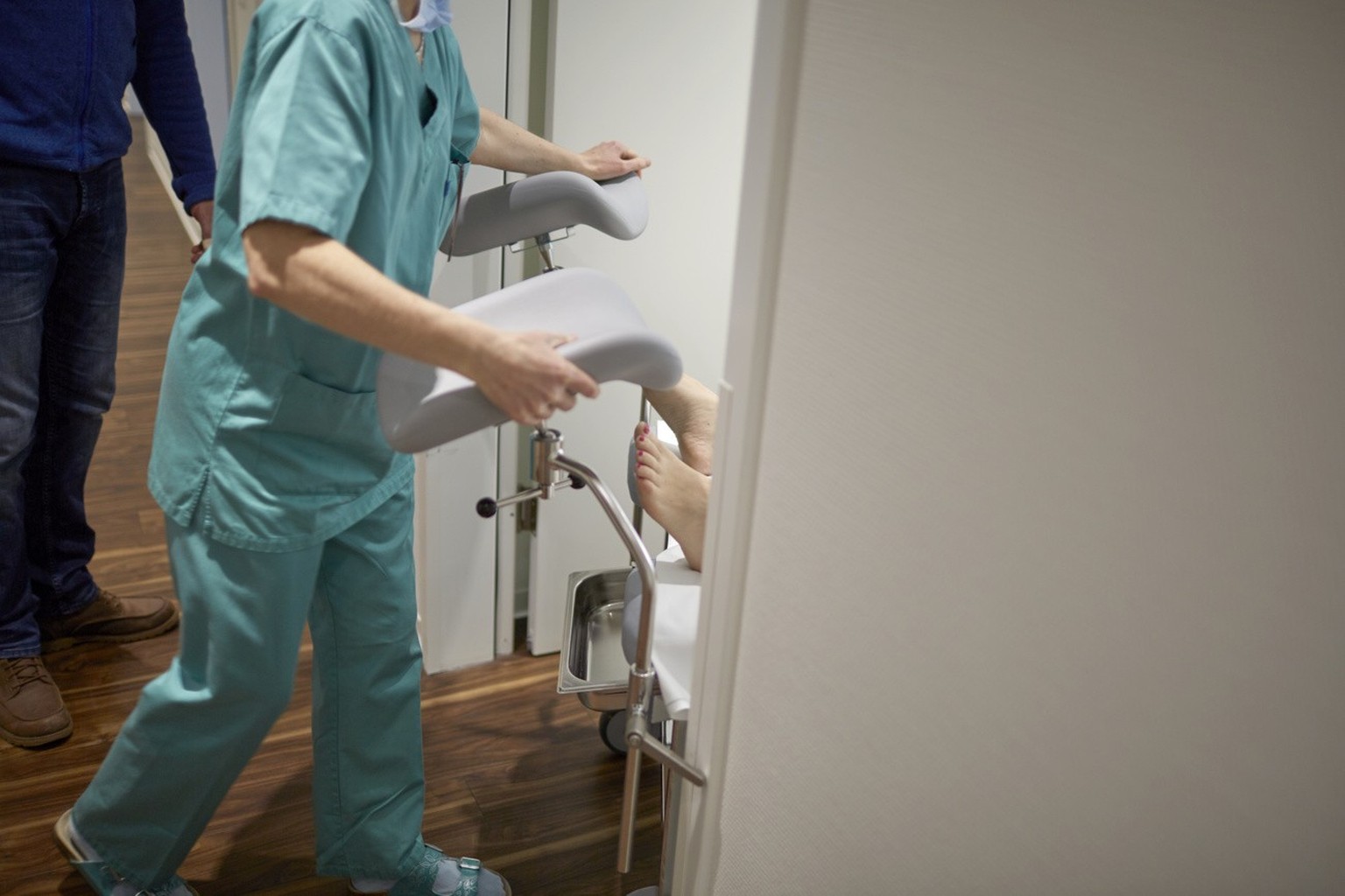 A nurse takes a patient back to her hospital room after a transfer of fertilised egg cells, pictured at the GYN-A.R.T. center for gynaecology, reproductive medicine, microsurgery, minimally invasive s ...