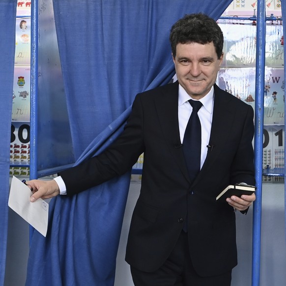 Presidential candidate Nicusor Dan exits a voting cabin before casting his vote in the second round of the country&#039;s presidential election redo in Fagaras, Romania, Sunday, May 18, 2025. (AP Phot ...