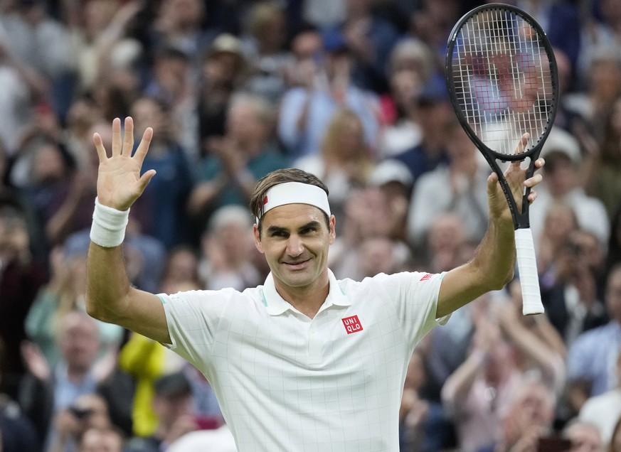 Switzerland&#039;s Roger Federer celebrates after defeating Italy&#039;s Lorenzo Sonego during the men&#039;s singles fourth round match on day seven of the Wimbledon Tennis Championships in London, M ...