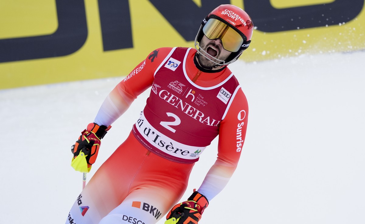 Switzerland's Loic Meillard gets to the finish area after completing an alpine ski, men's World Cup slalom in Val d'Isere, France, Sunday, Dec.15, 2024. (AP Photo/Giovanni Auletta)