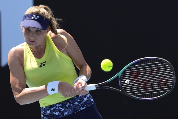 Dayana Yastremska of Ukraine plays a backhand return to Madison Brengle of the U.S. during their first round match at the Australian Open tennis championships in Melbourne, Australia, Monday, Jan. 17, ...