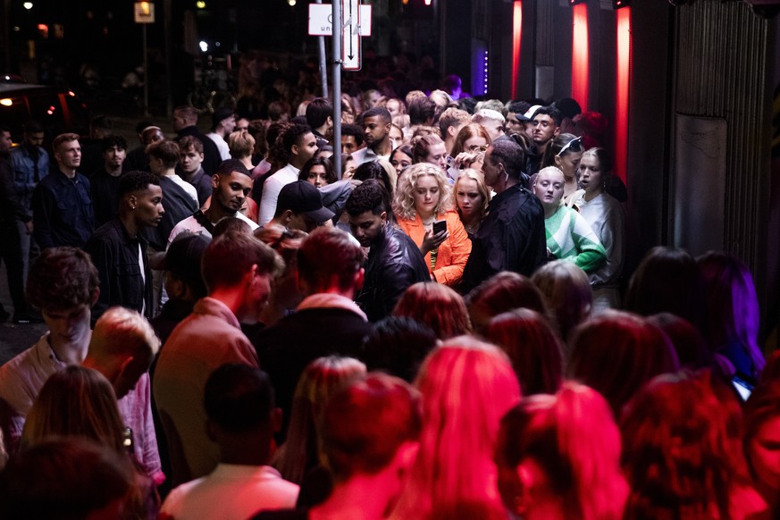 epa09444616 Nightlife guests gather in front of Rumors on Noerregade in Copenhagen, Denmark, 03 September 2021. From Wednesday, nightclubs and bars could be open more or less as usual with a dance flo ...