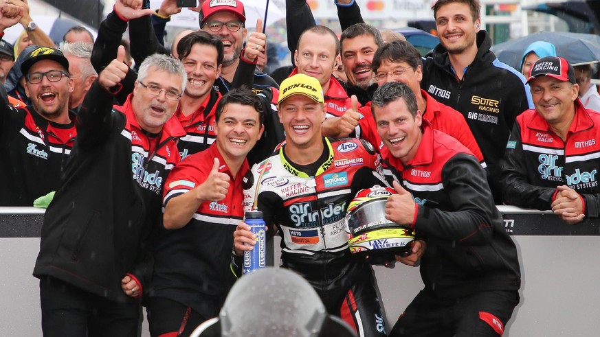 epa06196241 Swiss rider Dominique Aegerter of Kiefer Racing celebrates with teammates after winning the Moto2 Grand Prix of San Marino and Riviera of Rimini at Misano circuit, in Misano Adriatico, Ita ...