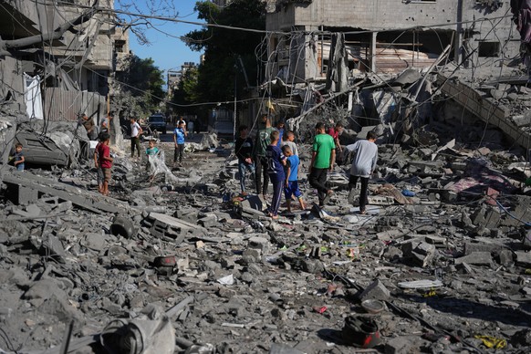 Palestinians inspect the rubble of a building destroyed in an Israeli airstrike in Nuseirat, central Gaza Strip, Tuesday, May 26, 2026. (AP Photo/Abdel Kareem Hana)
Israel Palestinians Gaza