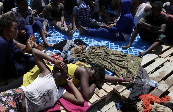 epa05496760 A handout picture taken and released by the Italian Red Cross shows migrants after being rescued during the MOAS operation in which 304 migrants were rescued from a dinghy off the Libyan c ...