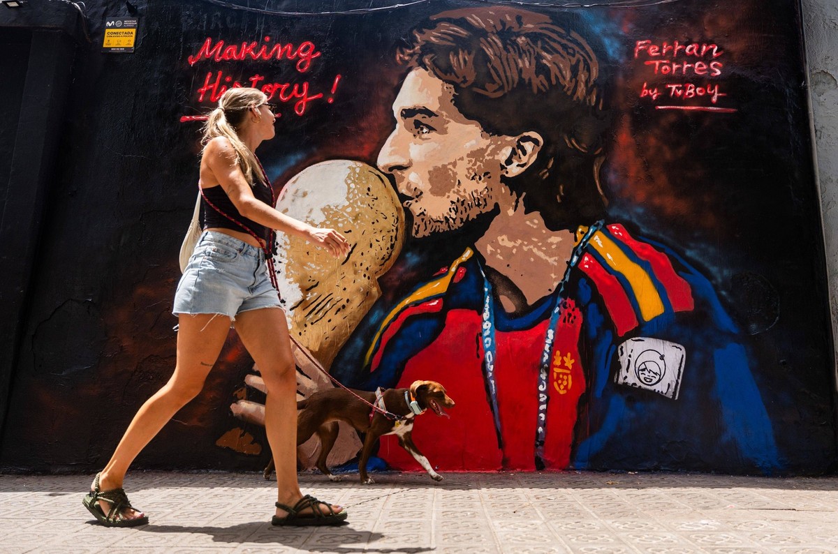 July 21, 2026, Barcelona, Spain: A mural by Italian street artist TVBoy depicting FC Barcelona forward Ferran Torres wearing the Spain national team jersey while holding the FIFA World Cup trophy is d ...