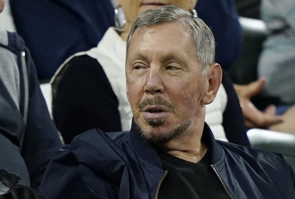 FILE - Larry Ellison, chairman of Oracle Corporation and chief technology officer, watches from the stands at the BNP Paribas Open tennis tournament Oct. 13, 2021, in Indian Wells, Calif. The world co ...
