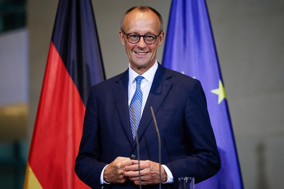 epa12251827 German Chancellor Friedrich Merz looks on during a press conference with Norway&#039;s prime minister at the chancellery in Berlin, Germany, 21 July 2025. EPA/CLEMENS BILAN