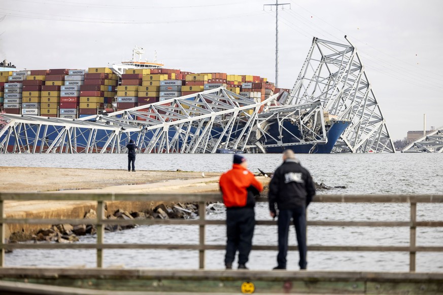 epa11244577 The Francis Scott Key Bridge rests partially collapsed after a cargo ship ran into it in Baltimore, Maryland, USA, 26 March 2024. The Maryland Department of Transportation confirmed that t ...