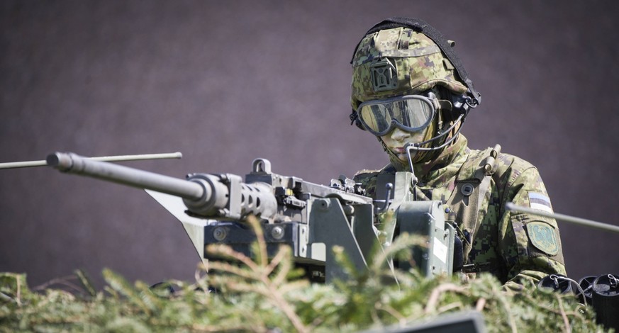 NATO Exercises In Estonia An Estonian soldier is seen in a camouflaged armoured personnel carrier in Tapa, Estonia on 20 May, 2023. Estonia is hosting the Spring Storm NATO exercises involving over 13 ...