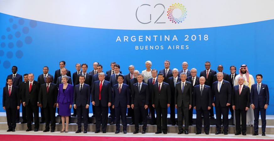 epa07199937 The Heads of State and Government of the G20 countries pose for the family picture during the G20 summit in Buenos Aires, Argentina, 30 November 2018. The Group of Twenty (G20) Summit brin ...