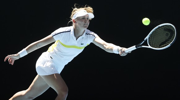 Switzerland&#039;s Jil Teichmann makes a forehand return to United States&#039; Coco Gauff during their first round match at the Australian Open tennis championship in Melbourne, Australia, Tuesday, F ...