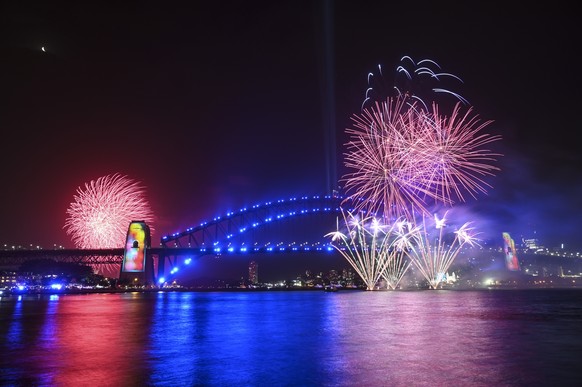 epa08095794 Fireworks explode over Sydney Harbour during the Family Fireworks as part of New Year&#039;s Eve celebrations in Sydney, Australia, 31 December 2019. The smaller firework is launched at 9p ...